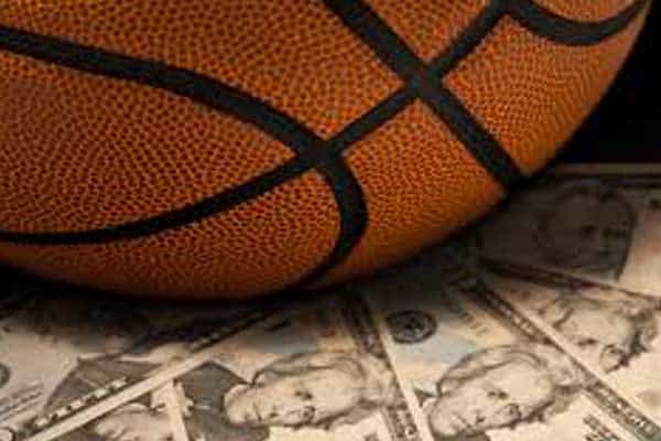 A basketball sitting on money