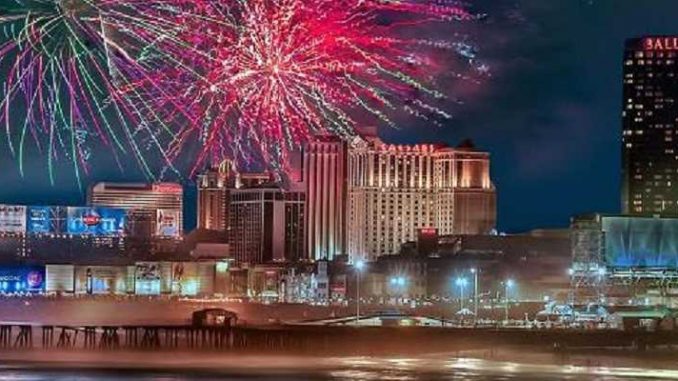 atlantic city casinos reopen for 4th of july fireworks going off over the boardwalk in atlantic city with casinos in the background