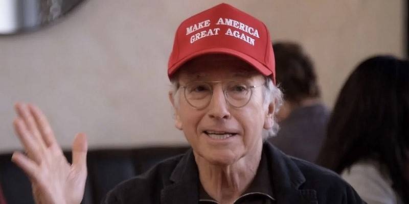 larry david of curb your enthusiasm wearing a red donald trump maga hat