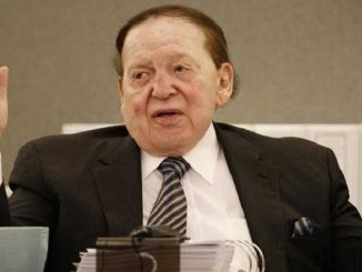 casino magnate sheldon adelson with his arms raised in exasperation