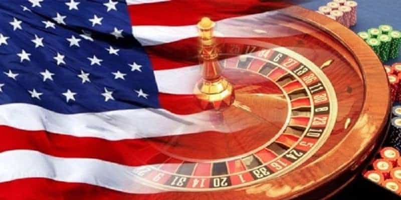 roulette table and casino chips overlaid with american flag