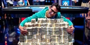 big poker win as player hugs pile of money