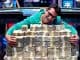 big poker win as player hugs pile of money