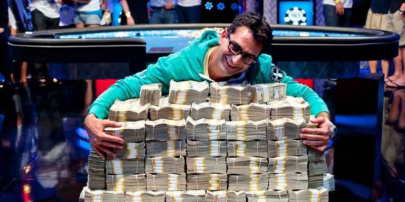 big poker win as player hugs pile of money