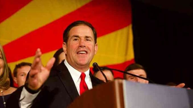 arizona governor doug ducey to sign az online sports betting law 2021 az governor doug ducey smiling at podium