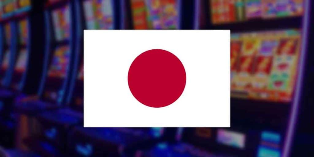 Japan flag over a row of slot machines