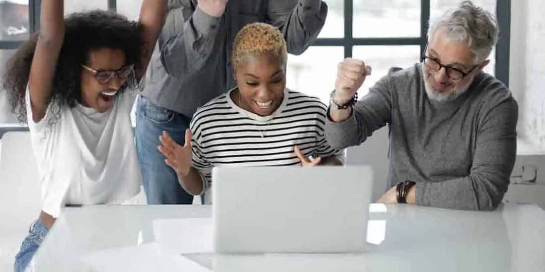 three gamblers celebrating their online win